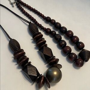 A Pair of 2 Brown Beaded Necklace’s one all wood & one gold wood bead